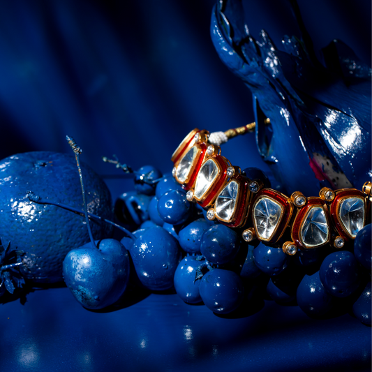 Gold-plated kundan-inspired statement necklace set showcasing bold fashion jewellery.