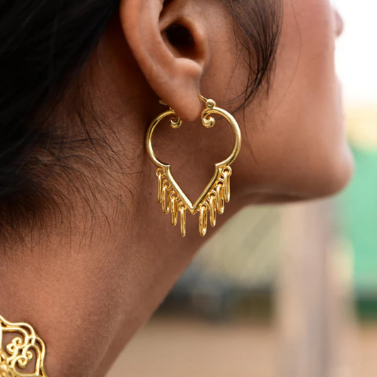 Gold-plated heart-shaped earring with dangling charms
