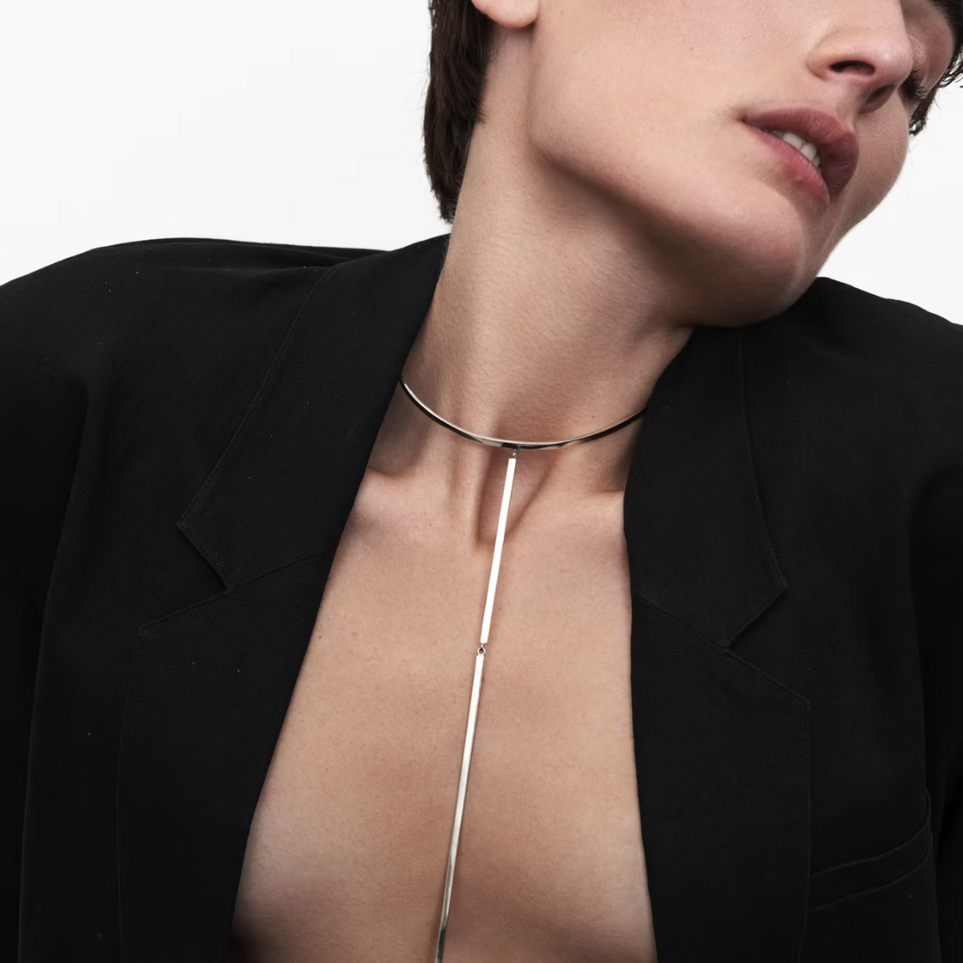 Long silver necklace with clean vertical design.