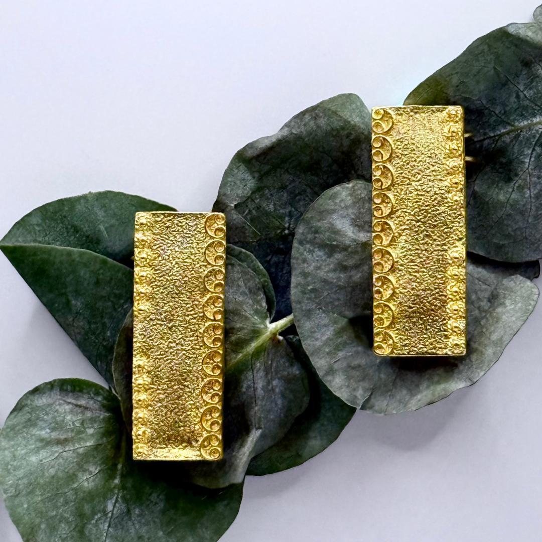 Gold-plated rectangular ear cuffs with textured finish and crescent-edge detailing