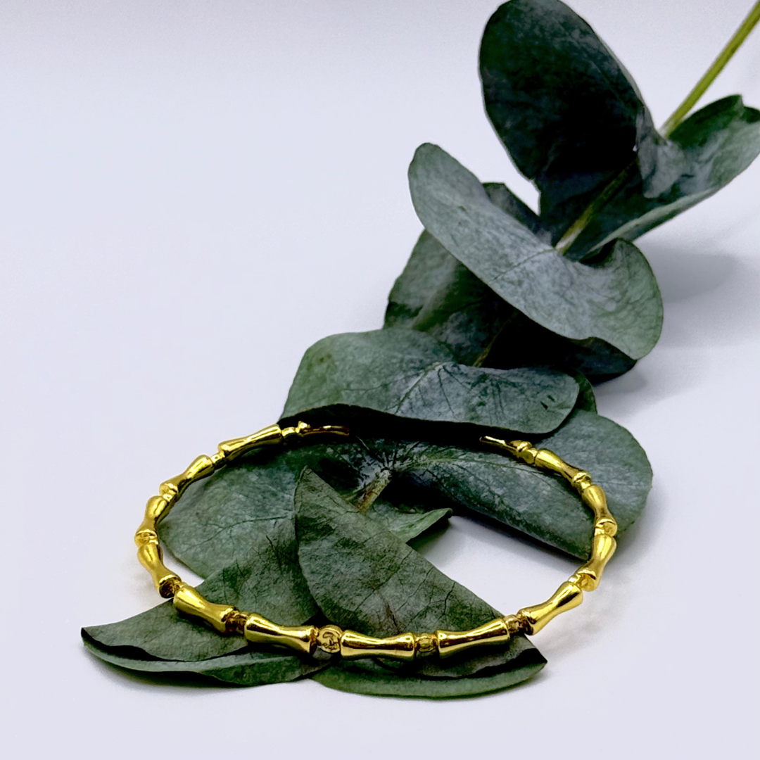 Liner Bracelet — 18k gold-plated bracelet with bamboo-style links and sleek, structured finish.