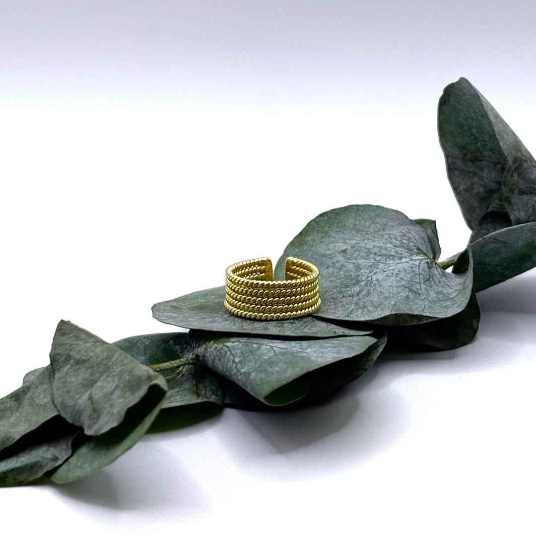 Gold-plated Looped Ring with layered coil design placed
