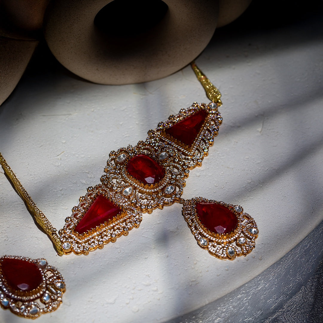 The jugni set - red glass stone choker set with matching earrings.