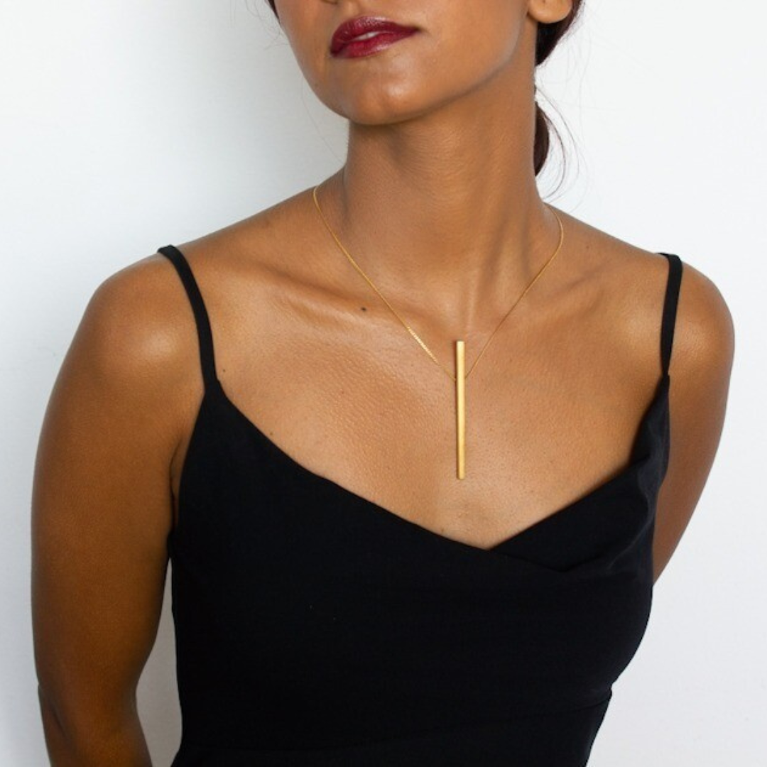 Minimal vertical gold plated pendant on fine chain necklace from the LINE collection