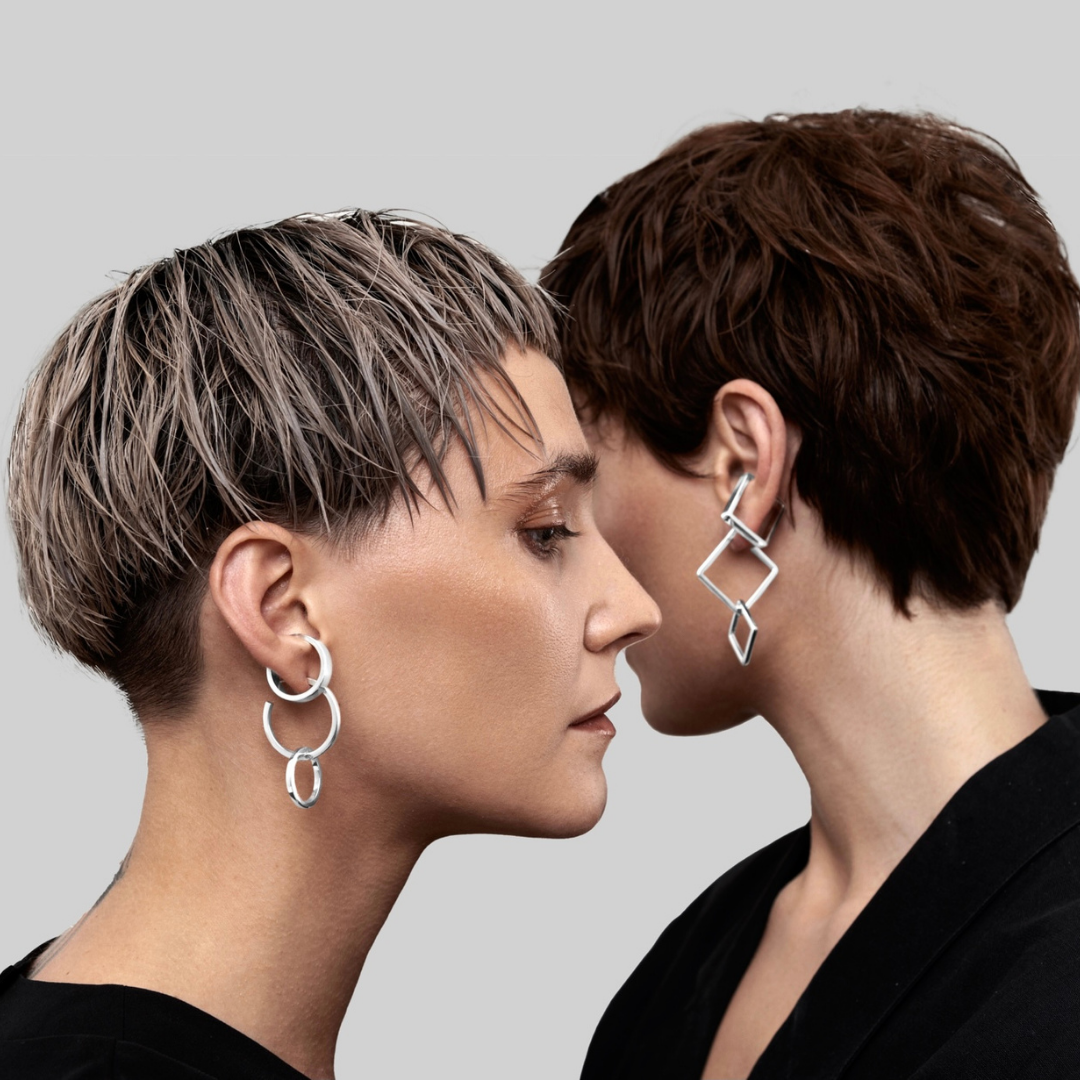 Earrings Set in handmade 925 sterling silver featuring mixed hoop and sculptural drop designs.