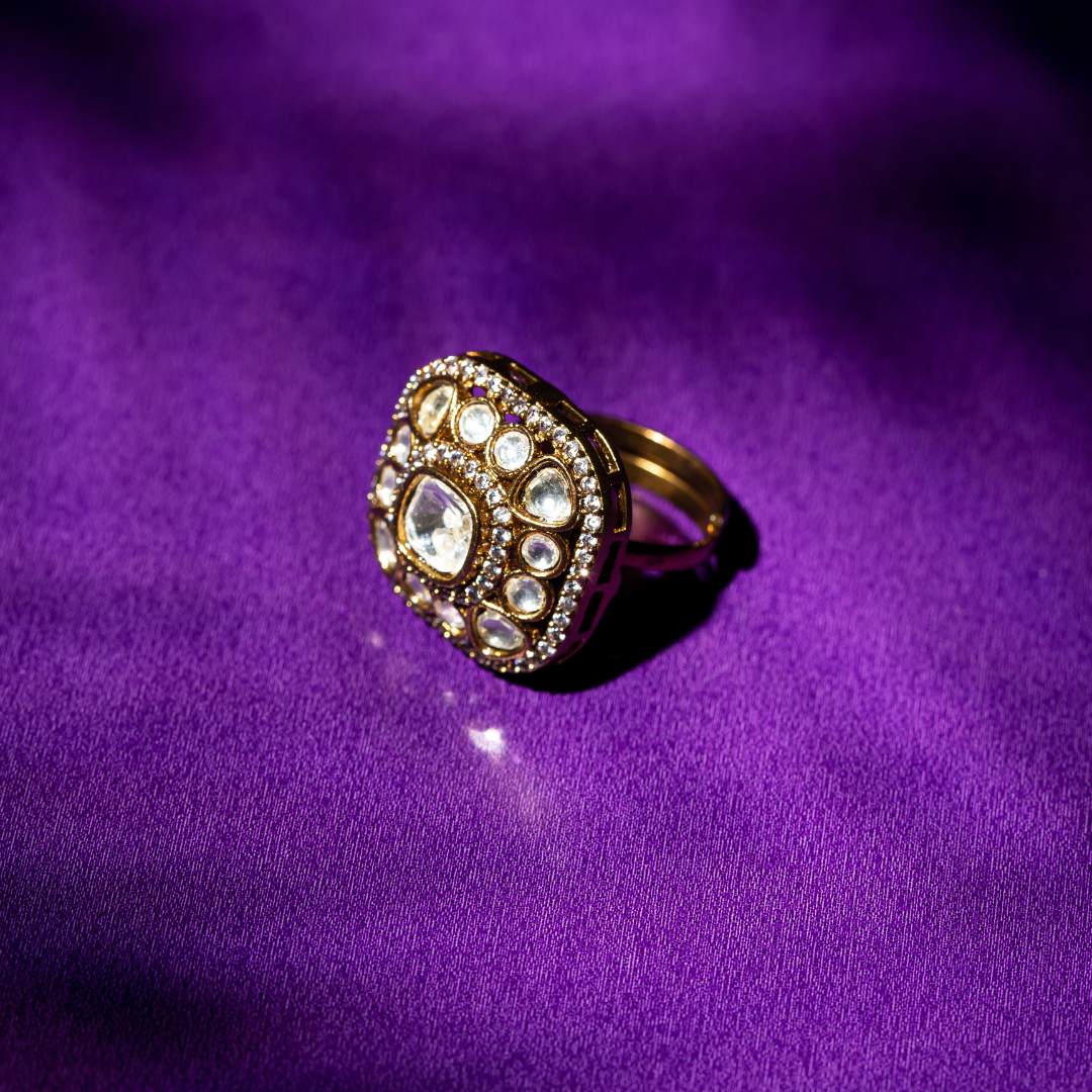 Square glass polki ring with crystal halo in gold finish.