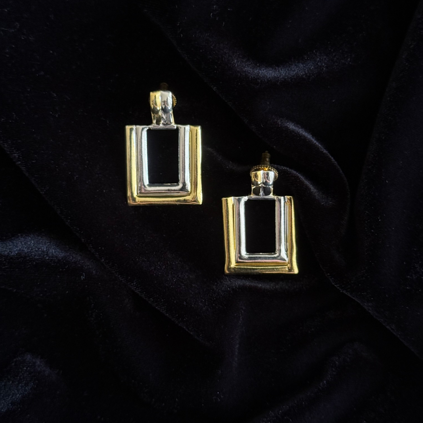 Two-toned gold and silver rectangular earrings with layered geometric design