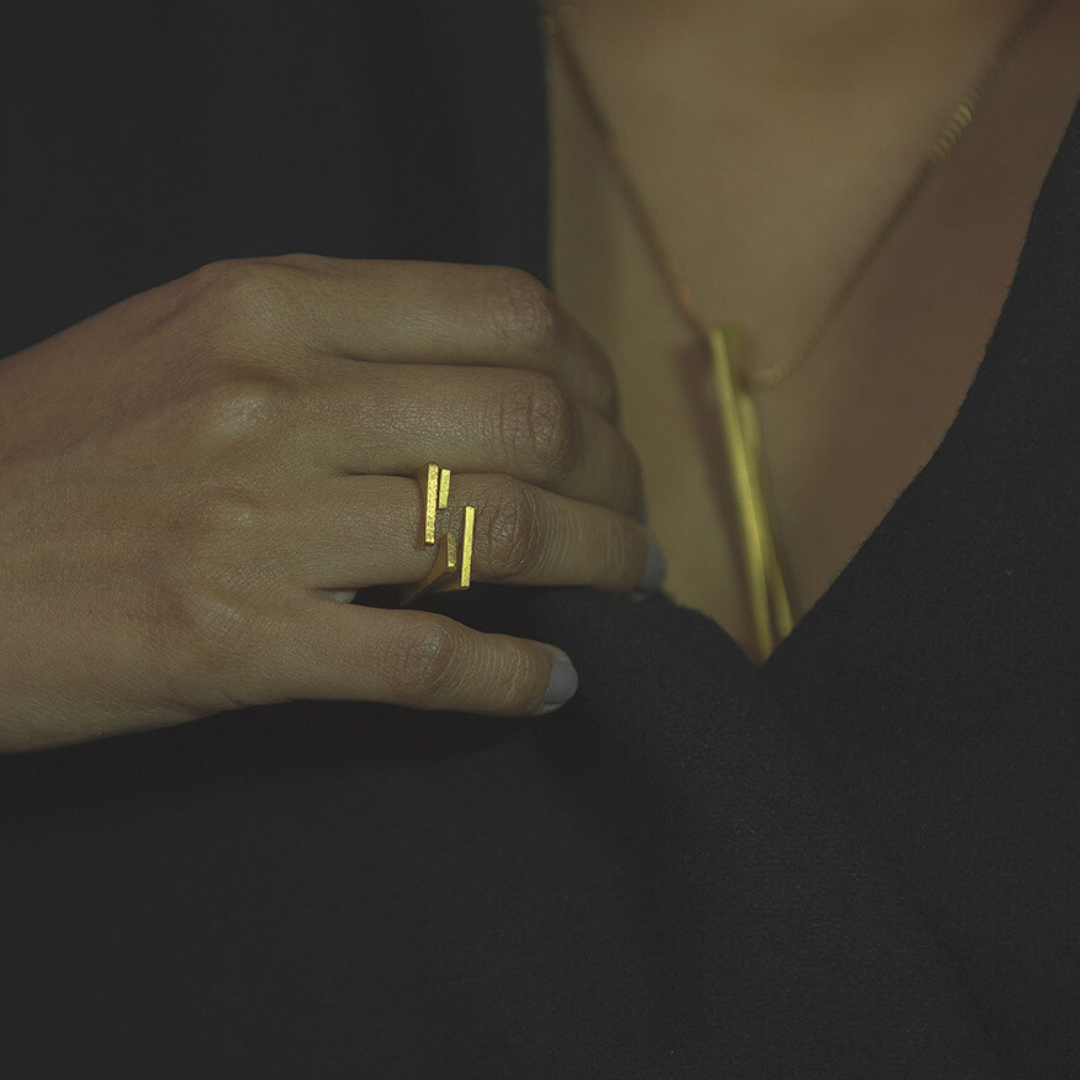 Contemporary gold plated brass ring with dual vertical bars, minimal 2D rotation design for everyday wear

