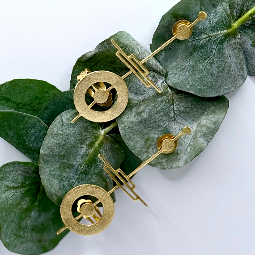 18k gold-plated geometric ear cuffs with circular and linear sculpted design
