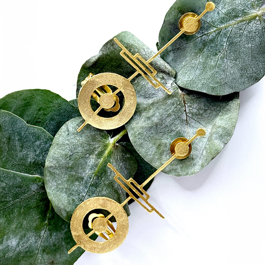 18k gold-plated geometric ear cuffs with circular and linear sculpted design
