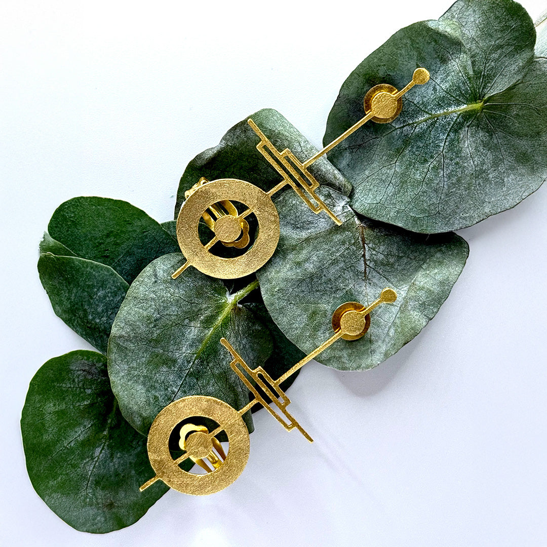 18k gold-plated geometric ear cuffs with circular and linear sculpted design
