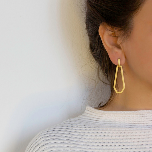 Hexagon gold plated brass earring with sculptural angular design, from bendable imitation jewelry collection