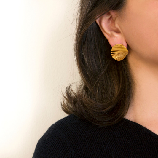 Minimal gold plated small circle earrings with fine horizontal etching from the LIQUIFY collection

