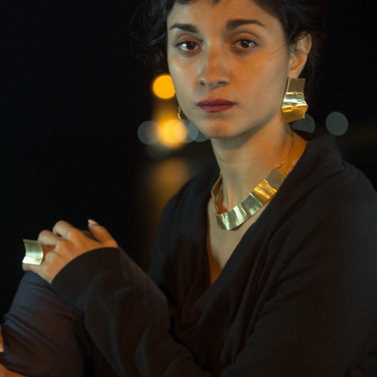 Minimalist gold plated brass earring from the LIQUIFY collection featuring refined etched detailing and a sleek, contemporary design

