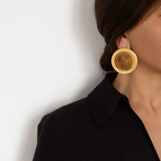 Gold plated brass circular earrings with layered cutout detailing, statement imitation jewelry from shape-shifting collection

