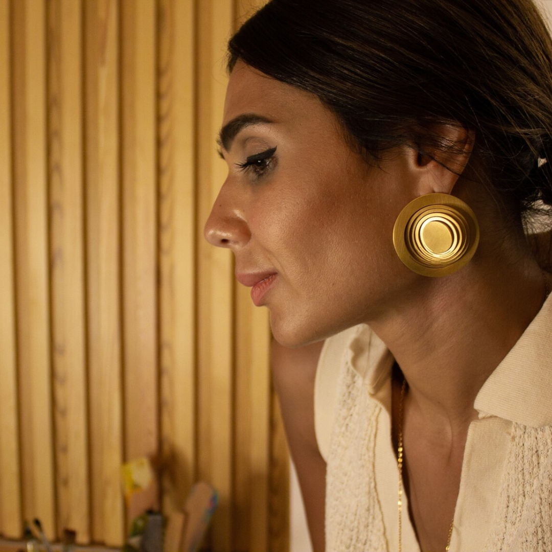 Gold plated brass circular earrings with layered cutout detailing, statement imitation jewelry from shape-shifting collection

