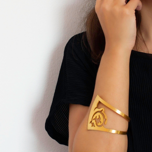 Gold plated statement cuff bracelet with floral cutout details from the FLORAL collection

