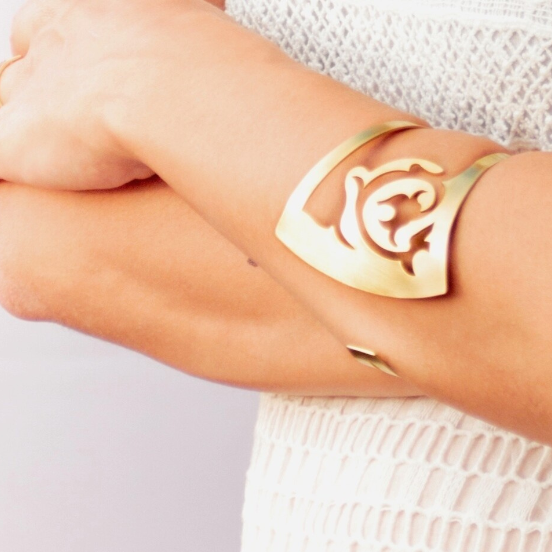 Gold plated statement cuff bracelet with floral cutout details from the FLORAL collection

