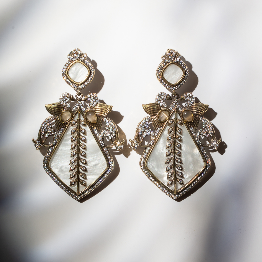 Ivory enamel earrings with gold brass and crystal wings

