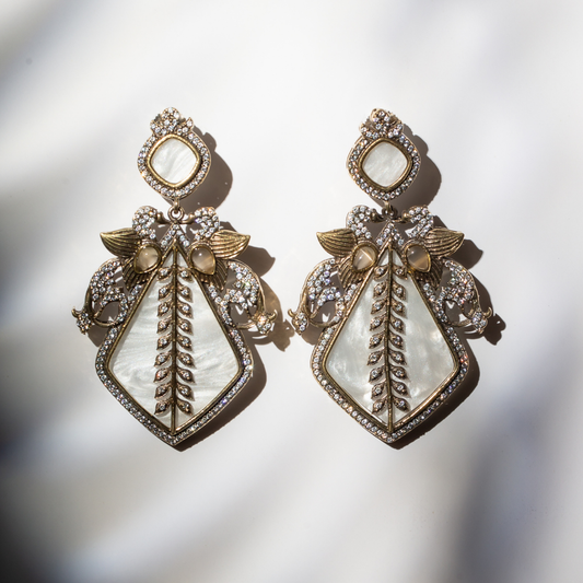 Ivory enamel earrings with gold brass and crystal wings

