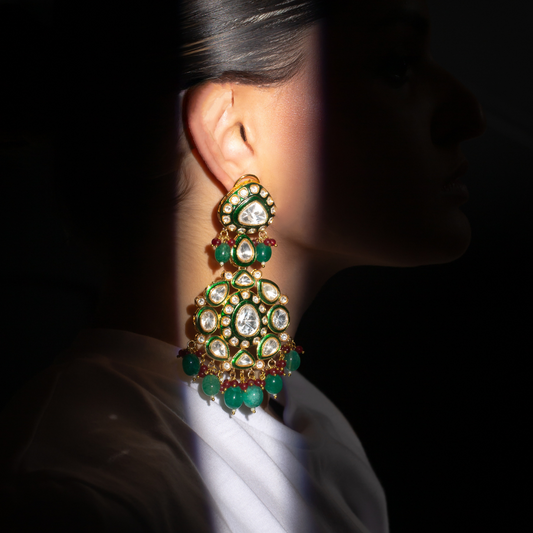 The Rajh earrings in gold plated brass with green and white accents