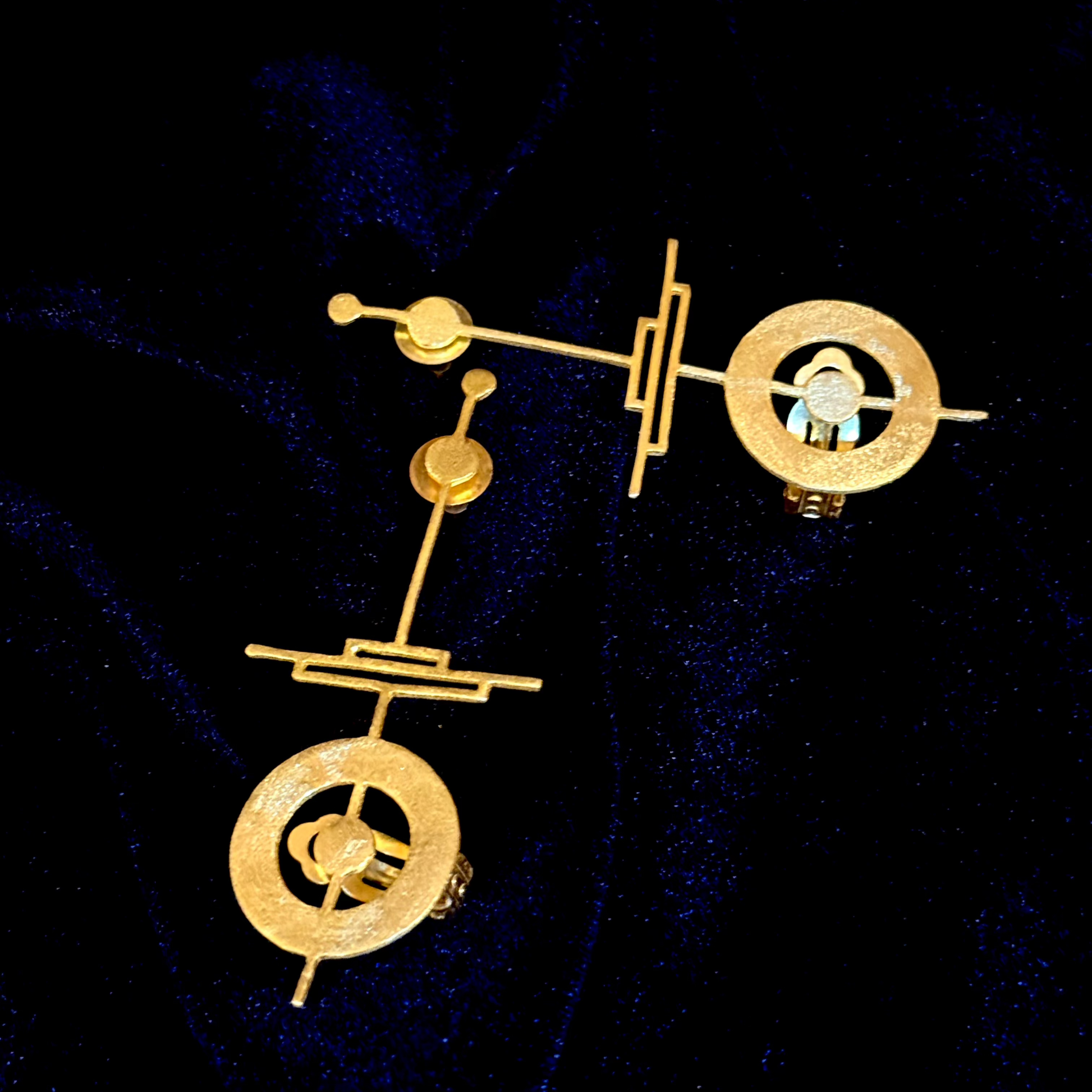 18k gold-plated geometric ear cuffs with circular and linear sculpted design
