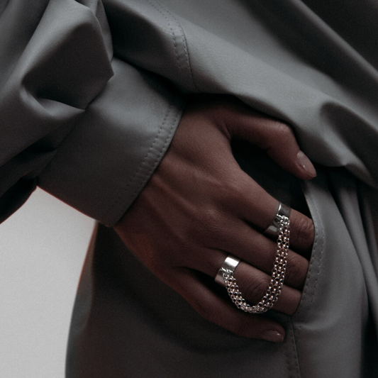 Double Ring with Chains in handmade 925 sterling silver featuring two rings linked with bold chains.

