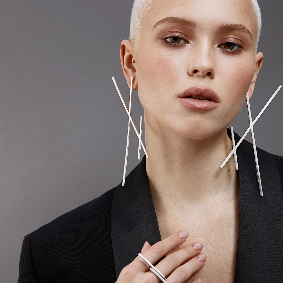 Earrings (Pairs) in handmade 925 sterling silver featuring long vertical linear design.

