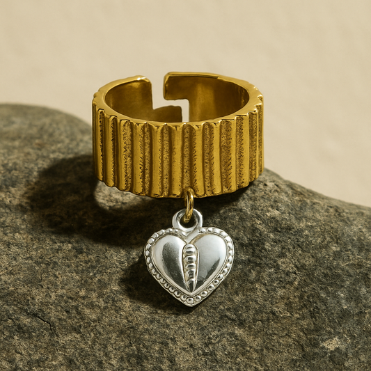 Chunky two-toned gold ring with silver heart charm and ribbed texture
