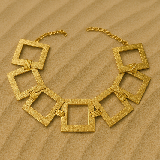 Textured gold choker with oversized square links and adjustable chain 

