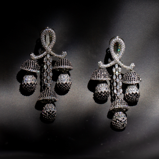 The Chaand Earrings in silver plated brass with layered crystal detailing and antique finish.

