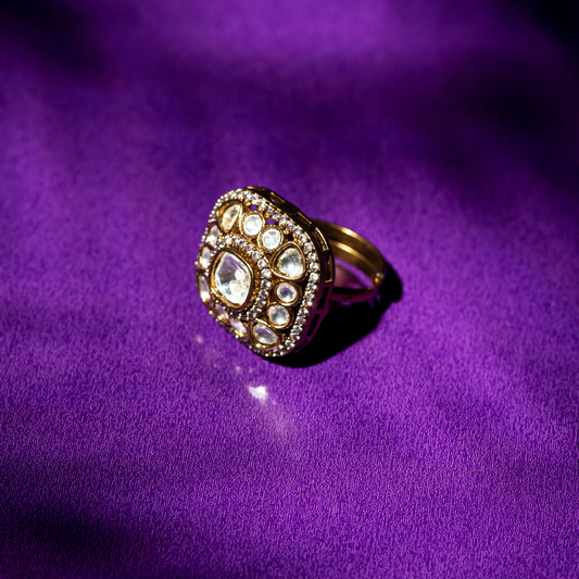 Square glass polki ring with crystal halo in gold finish.










