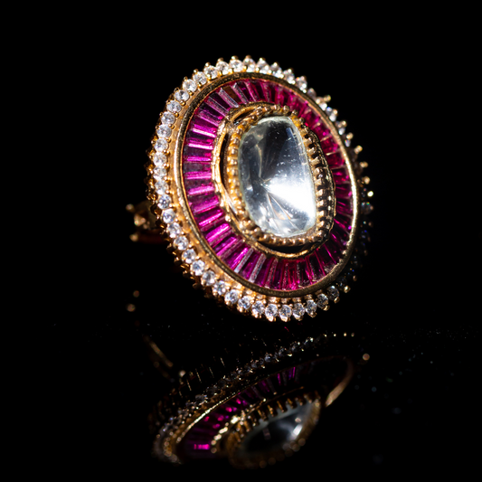 the gulal ring - gold plated fuchsia enamel ring with central crystal.
