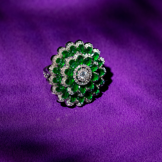 Scalloped green and white gold plated ring with crystal detailing.







