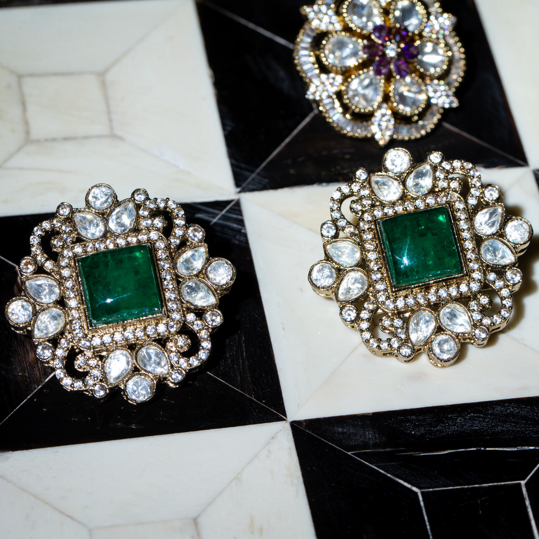 the nuur studs green square centre studs with crystal detailing.
