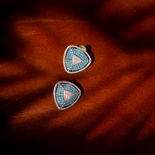 The Ocean Blue Studs in light blue stone with silver plated base and triangular frame

