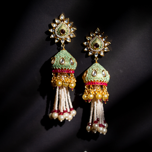 The Pankh Earrings with crystal tops, red and green tokri detailing, pearl drops and red beaded fringe.

