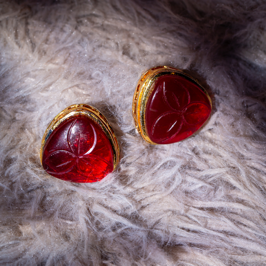the soot studs - gold plated red carved stone with brass base.

