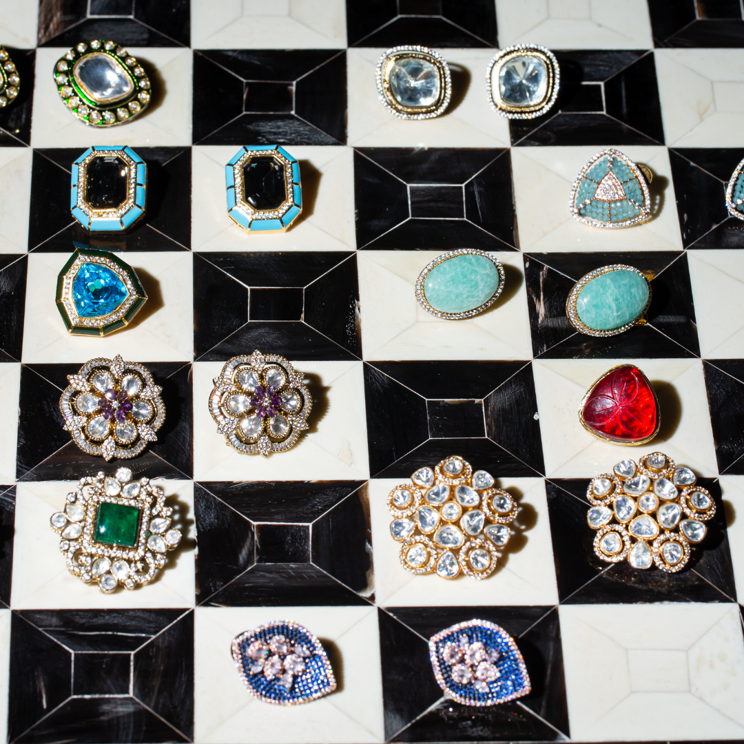 the sufi studs gold plated studs with enamel, crystal and glass polki.
