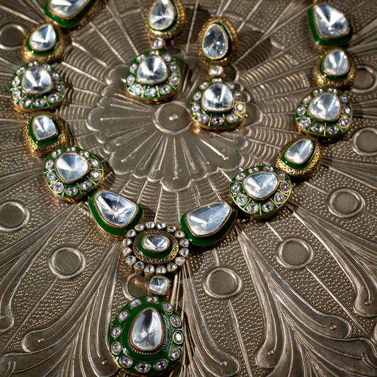 The Tarz Maala Set in green enamel and glass polki detailing on gold base, with matching earrings

