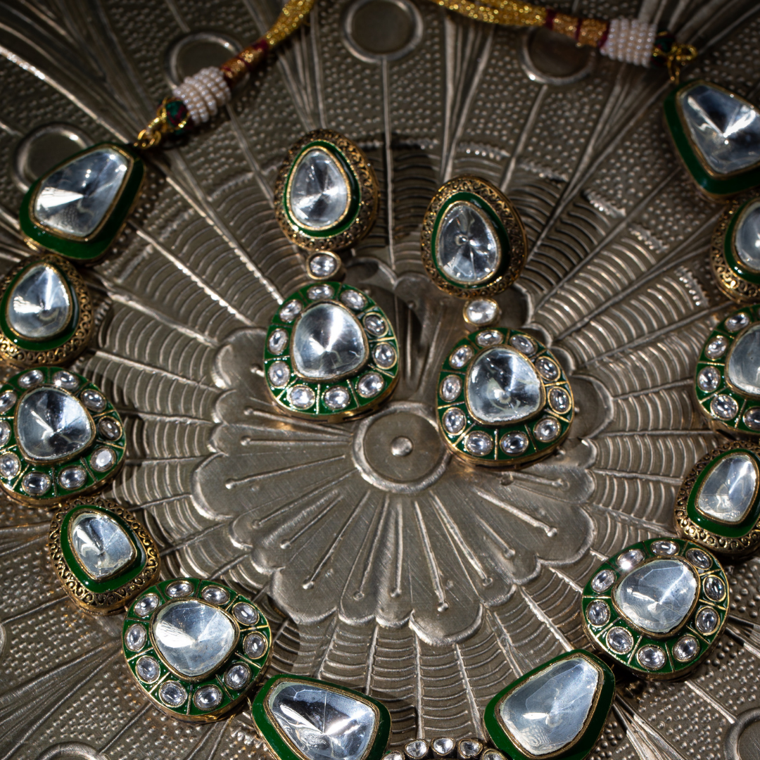 The Tarz Maala Set in green enamel and glass polki detailing on gold base, with matching earrings

