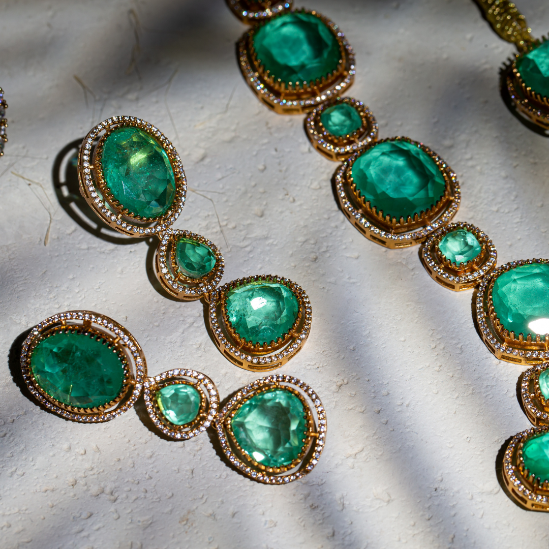The Vera Maala Set with double-layer green necklace, earrings, and maang tikka in gold base

