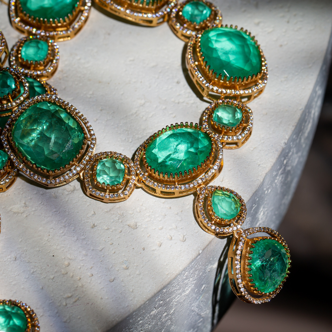 The Vera Maala Set with double-layer green necklace, earrings, and maang tikka in gold base

