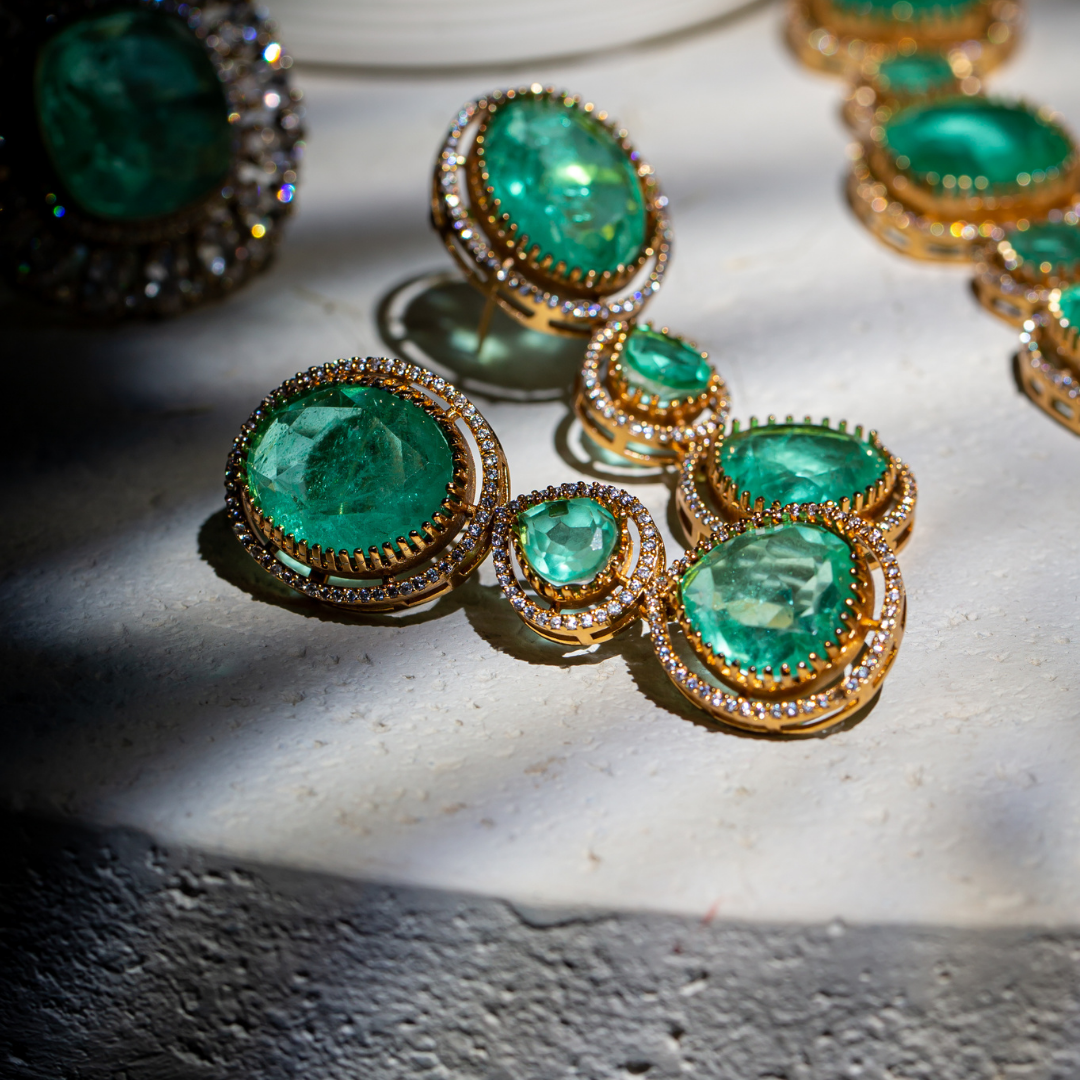 The Vera Maala Set with double-layer green necklace, earrings, and maang tikka in gold base

