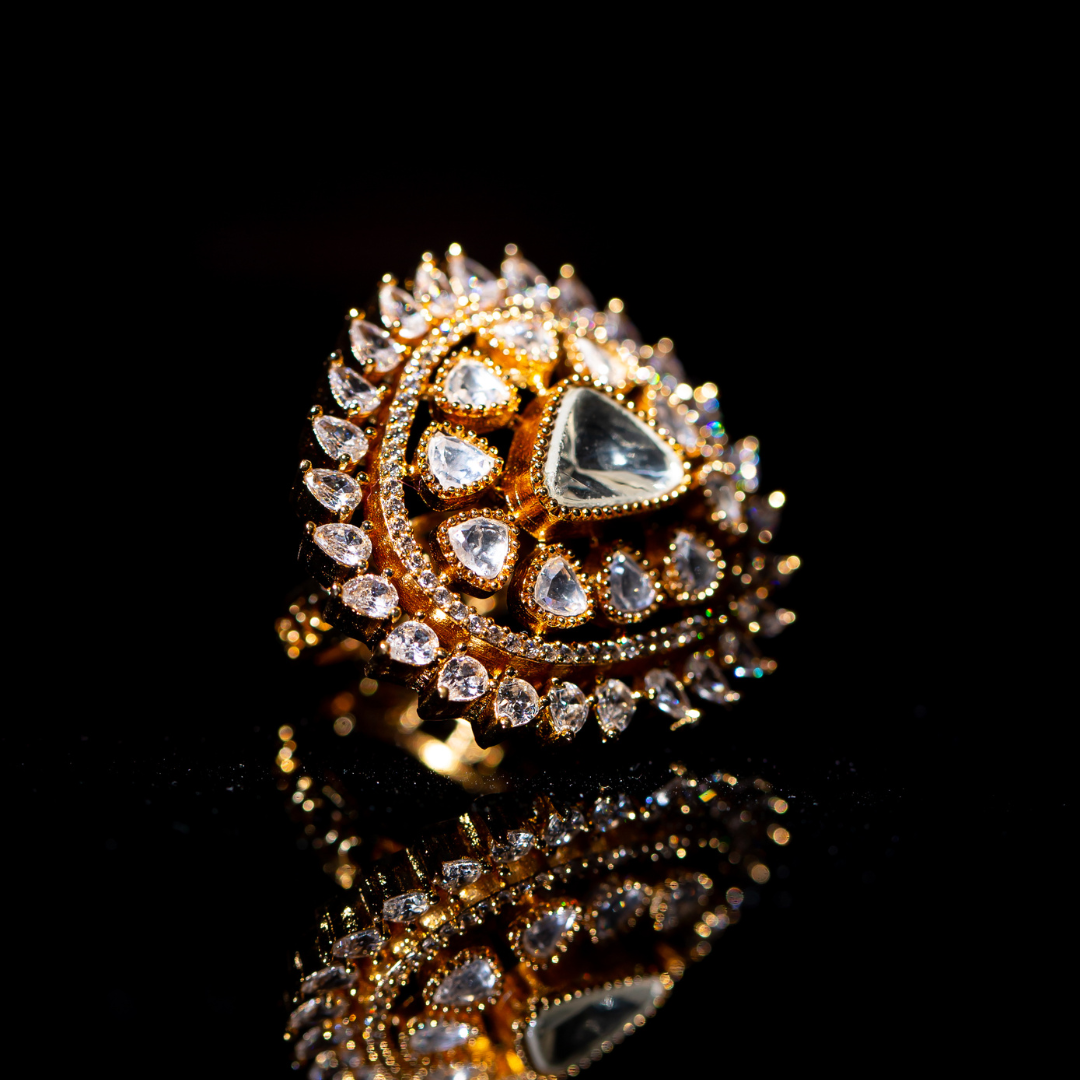 The Zeen Ring in crescent shape with glass polki and crystal detailing.







