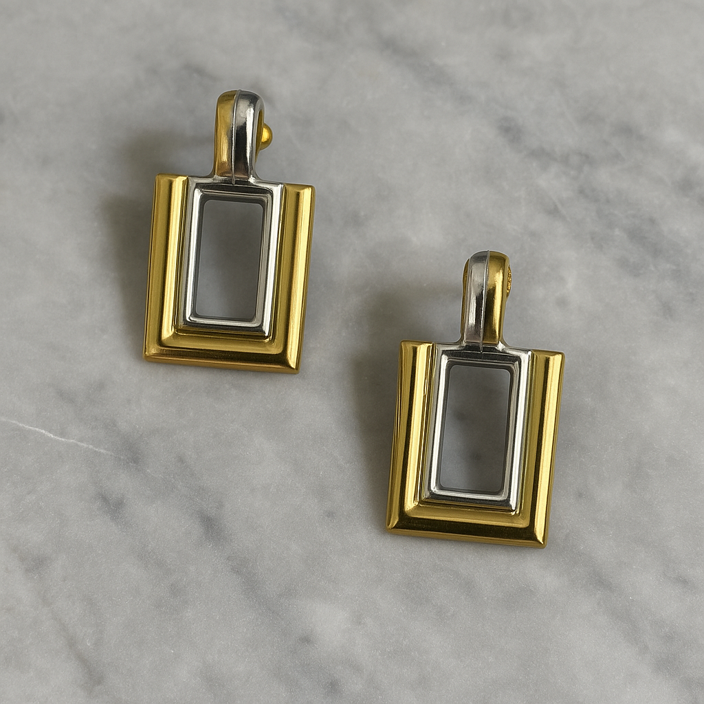 Two-toned gold and silver rectangular earrings with layered geometric design
