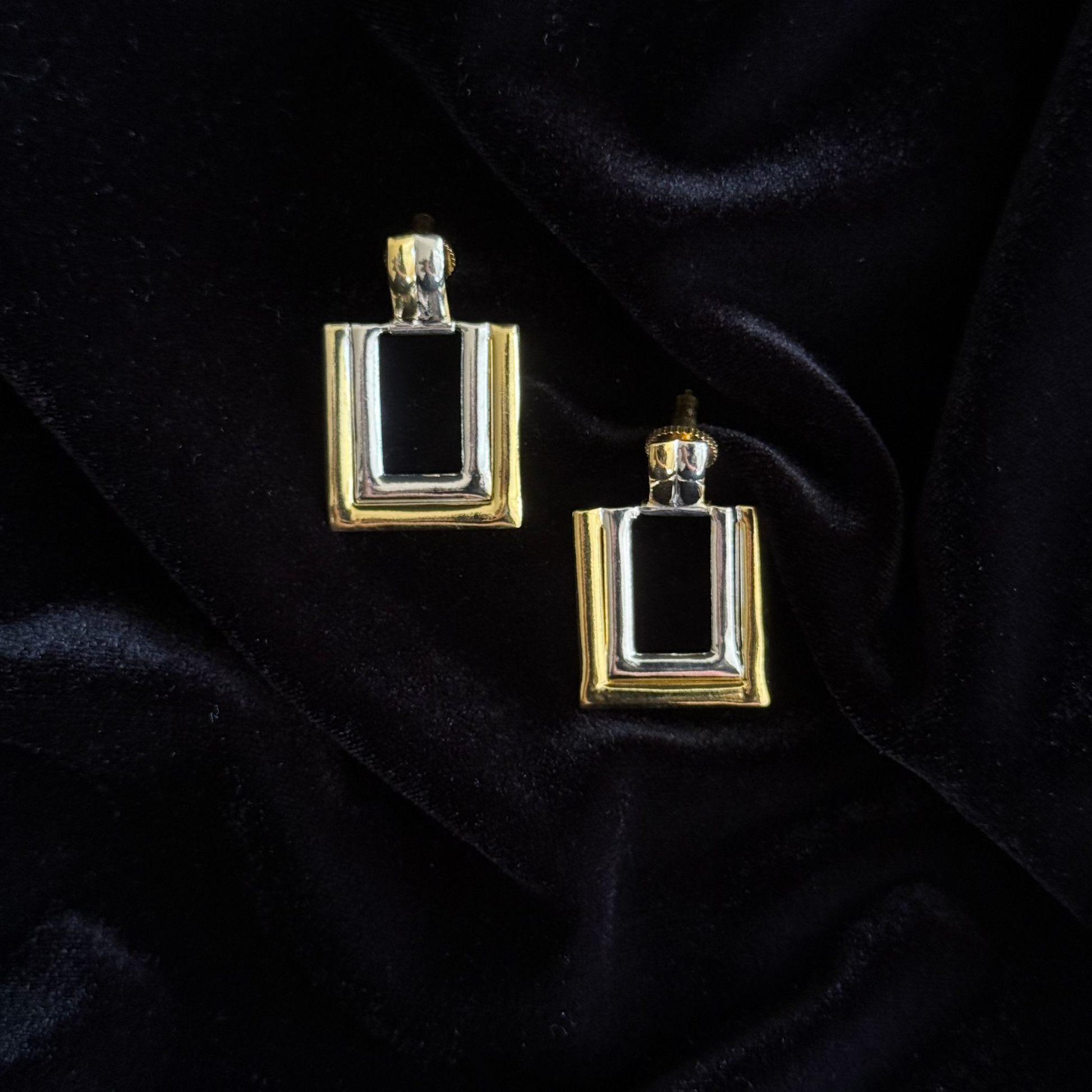 Two-toned gold and silver rectangular earrings with layered geometric design
